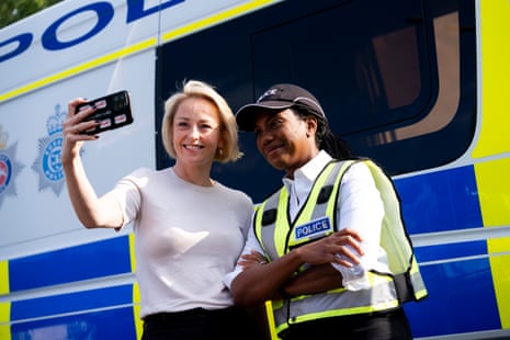 Conservative Party leader Kemi Badenoch poses for a selfie.