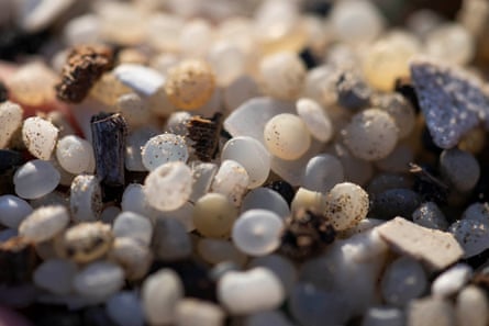 Close-up of tiny translucent balls in sand