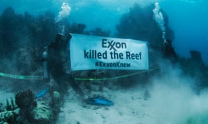 350.org underwater protest against Exxon and its responsibility in coral bleaching