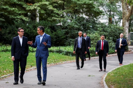 Andy Burnham (left) and Pedro Sánchez in Central Park this morning, with security detail walking behind.