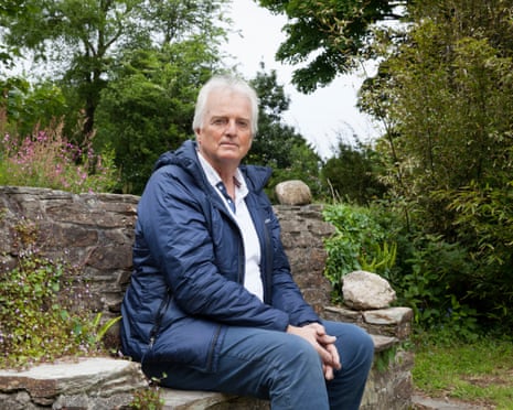Peter Hall sitting in a garden