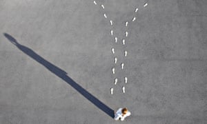 Woman looking at diverging footprints