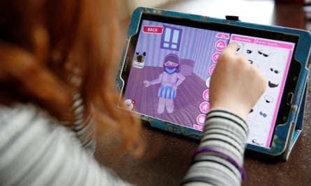 A girl using a tablet to design a Roblox character