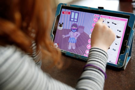 A child playing with her character on Roblox.