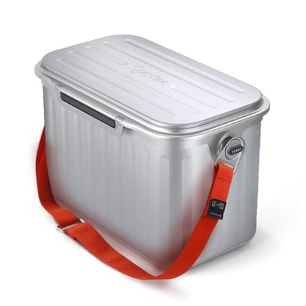 An Oyster The Tempo Cooler in silver with a red shoulder strap
