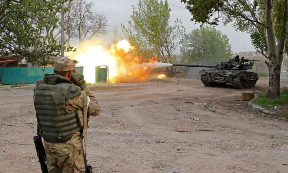 Russian troops fire from a tank in Mariupol near the Azovstal steel plant 