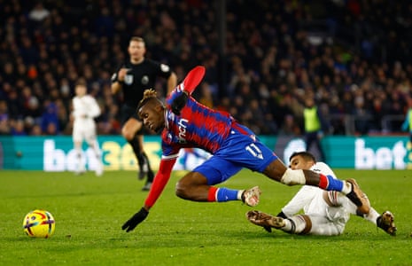 Casemiro clatters in to Wilfried Zaha and earns himself a booking.