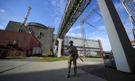A Russian serviceman guards an area of the Zaporizhzhia nuclear power station.