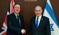 David Cameron and Benjamin Netanyahu shaking hands in front of UK and Israel flags