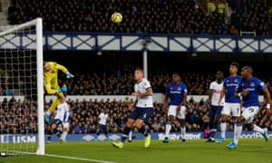 Pickford dives to clear.