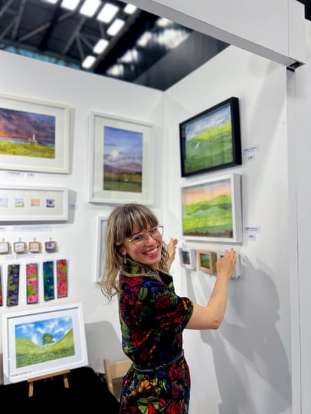 Wiktoria Anna with her watercolour paintings and prints on her market stall
