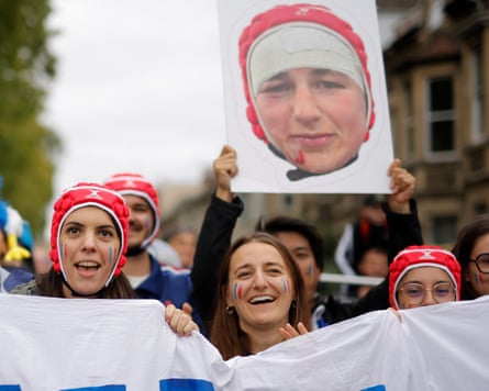 France fans paying homage to their back row forward Charlotte Escudero as they wait to greet the team bus outside the stadium.