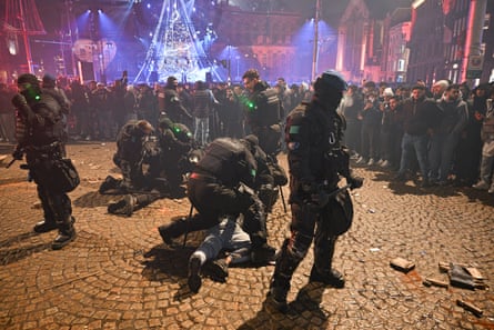 Police arresting people setting off fireworks