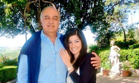 Morad Tahbaz, wearing blue cotton shirt, in a sunny garden with his arm around his daughter Roxanne