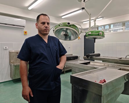 Dahir standing in an empty autopsy room