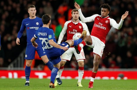 Arsenal’s Alex Iwobi and Chelsea’s Cesar Azpilicueta tussle for the ball.