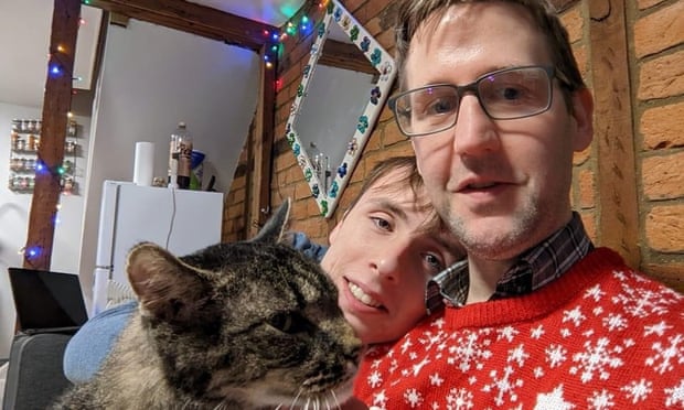 Ben (left) and Simon, with their cat, Seth