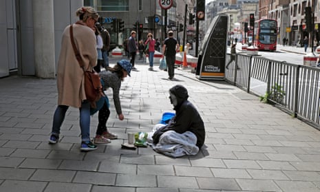 Girl giving money to a homeless woman
