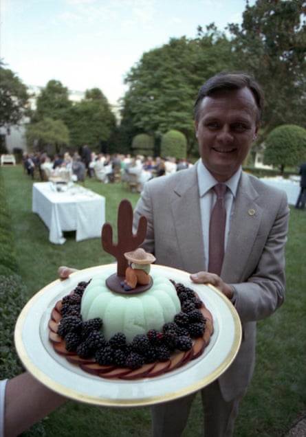 a men holding a cake