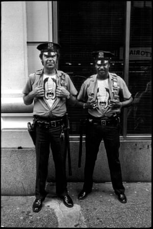 Two policemen with matching t-shirts under their uniforms