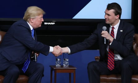 Older white man shakes hands with younger white man