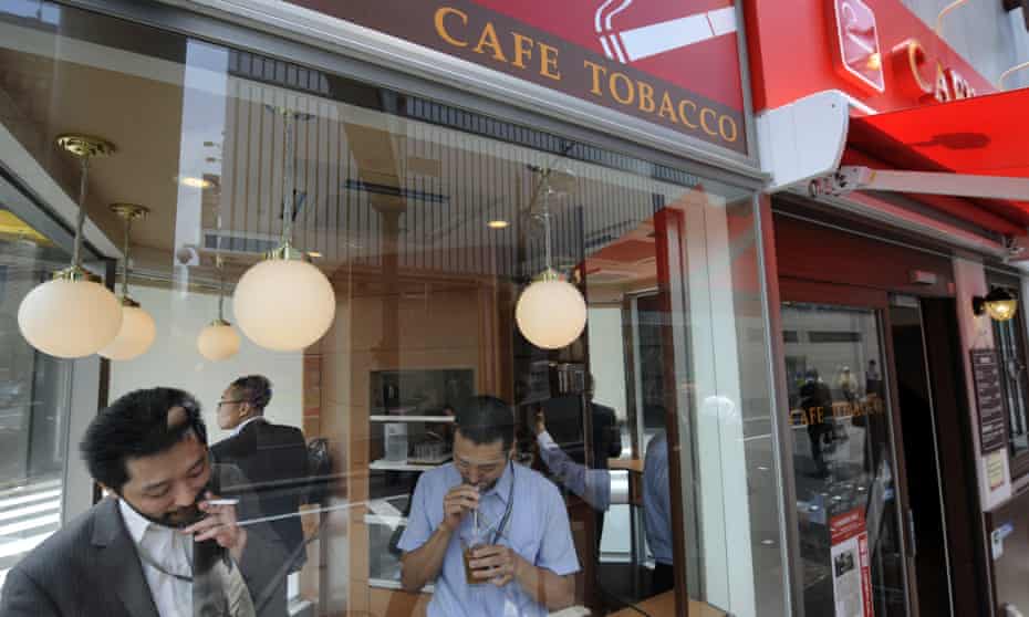 Businessmen at a ‘Cafe Tobacco’ shop in Tokyo’s Shinbashi district