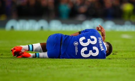 Chelsea’s Wesley Fofana lies injured on the turf at Stamford Bridge