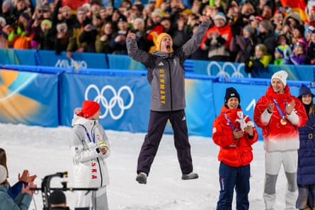 Philipp Raimund celebrates gold, flanked by Poland’s Kacper Tomasiak (left) and bronze medallists Ren Nikaido, of Japan, and Gregor Deschwanden, of Switzerland.