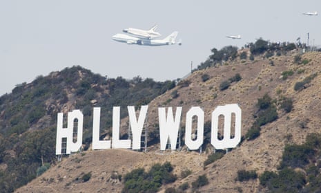 Trouble overhead … aircraft pass the Hollywood sign. 