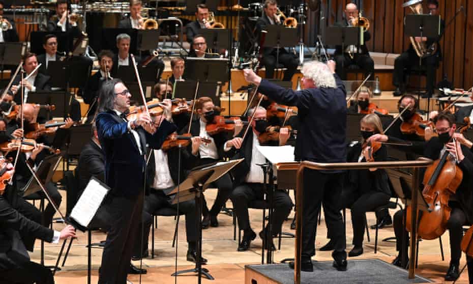 ‘Hugely impressive’ … Soloist Leonidas Kavakos with Simon Rattle and the London Symphony Orchestra.