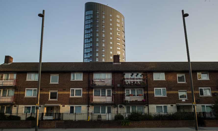 A new tower of apartments stands behind older housing in Stratford, east London.