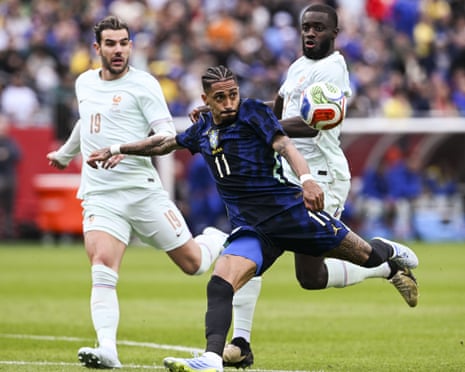 Raphinha of Brazil lines up a shot.