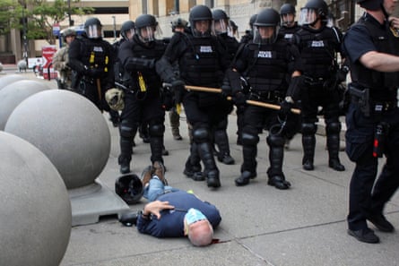 Martin Gugino lays on the ground after he was shoved by two Buffalo, New York, police officers during a protest.