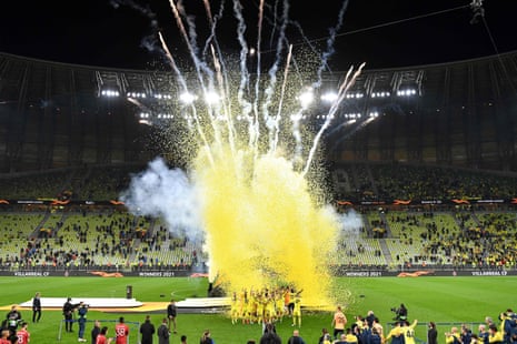 Villarreal’s players celebrate with the trophy after winning the Europa League.