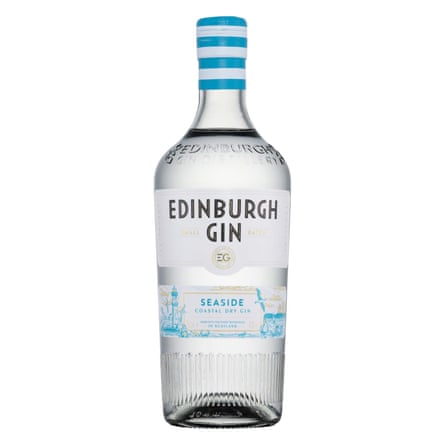 A clear bottle of Edinburgh Gin Seaside Gin. The label is white with blue details and the lid has a nautical themed blue and white stripe design.