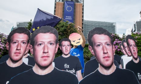 Cardboard cutouts of Facebook CEO Mark Zuckerberg during a protest over fake accounts outside the European commission in Brussels in May 2018.