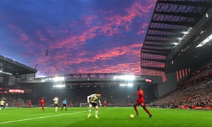 The sun sets over Anfield.