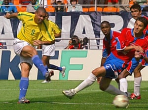 Ronaldo scores the second goal for Brazil against Costa Rica during their Group C match.