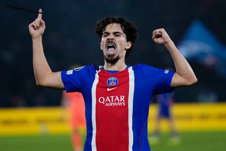 Vitinha shouts and raises both fists celebrating a goal for PSG