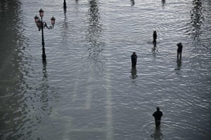 Venetians cross the Piazza San Marco