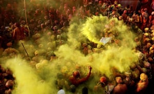 Devotees celebrate the Holi Festival at Krishna Temple in Nandgaon, India. Siena International Photo Awards