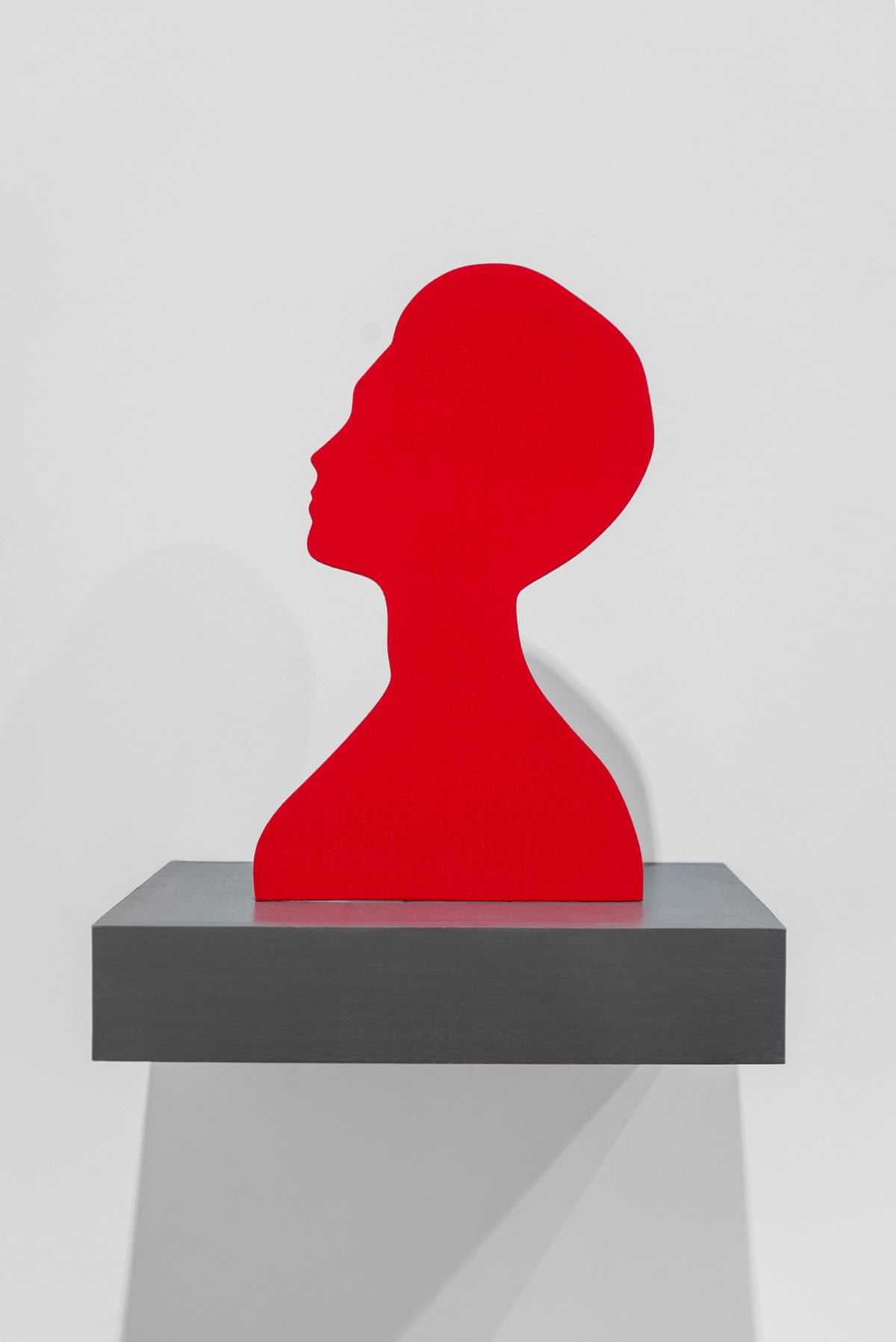 A head figure in red