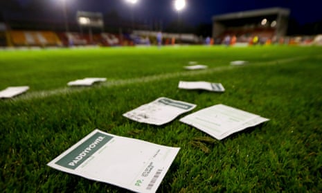 Betting slips on football pitch