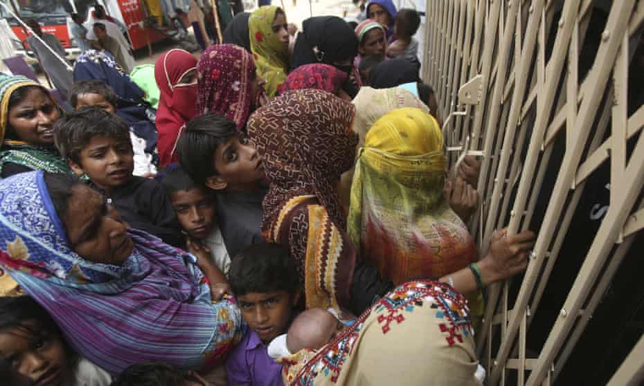 Pakistani villagers wait outside a hospital to be screened for HIV in the southern province of Sindh.