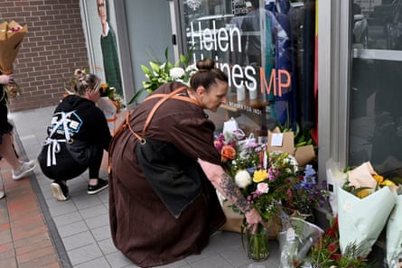 Locals lay flowers outside Haines’s office on Tuesday.