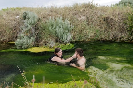Two swimmers in green water