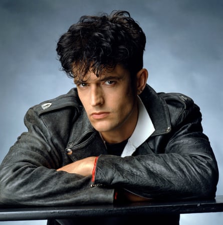 Portrait of Rupert Everett as a young man in a leather jacket