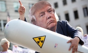 An anti-nuclear activist in Germany wearing a Trump mask