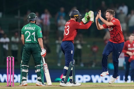 England's Liam Dawson, right, celebrates with Jos Buttler after taking the wicket of Pakistan's Mohammad Nawaz.