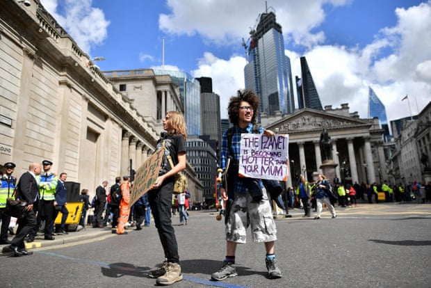 Climate change activists demonstrate outside the Bank of England